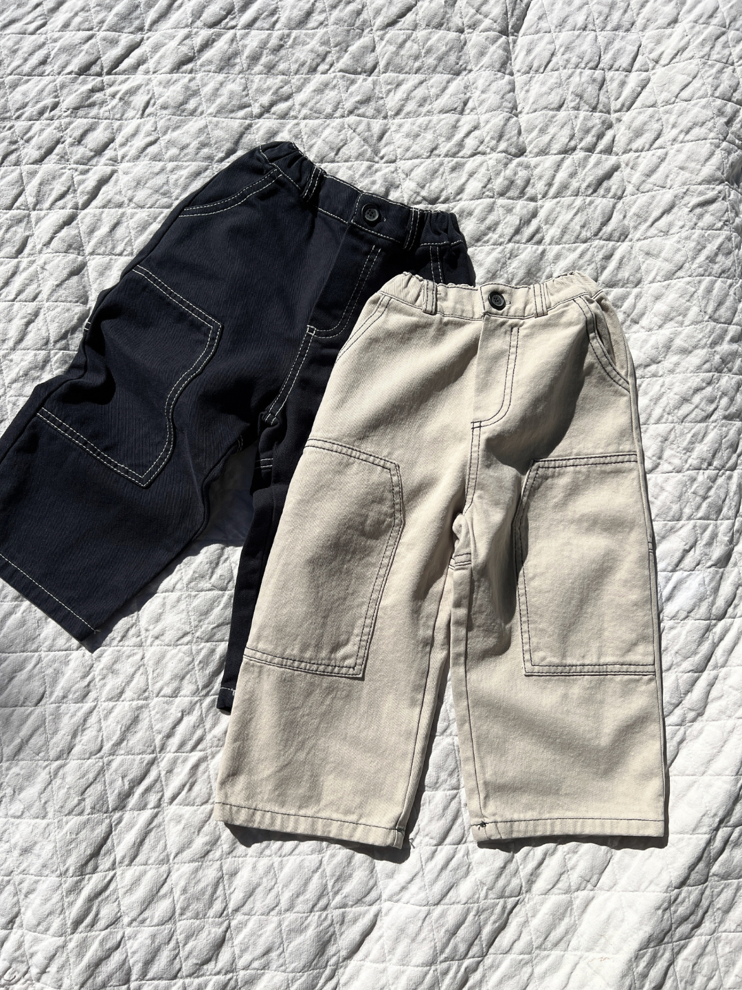 Stone | Stone & Dark Indigo Stitch Jean laid on blanket