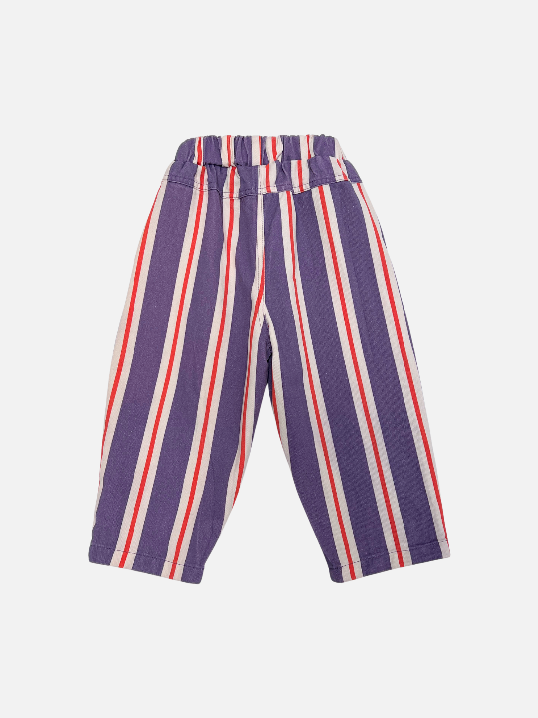 The STRIPE TWILL PANT is a children's pull-on design in cotton twill with vertical purple, white, and red stripes, an elastic waistband, and shown laid flat on a white background.