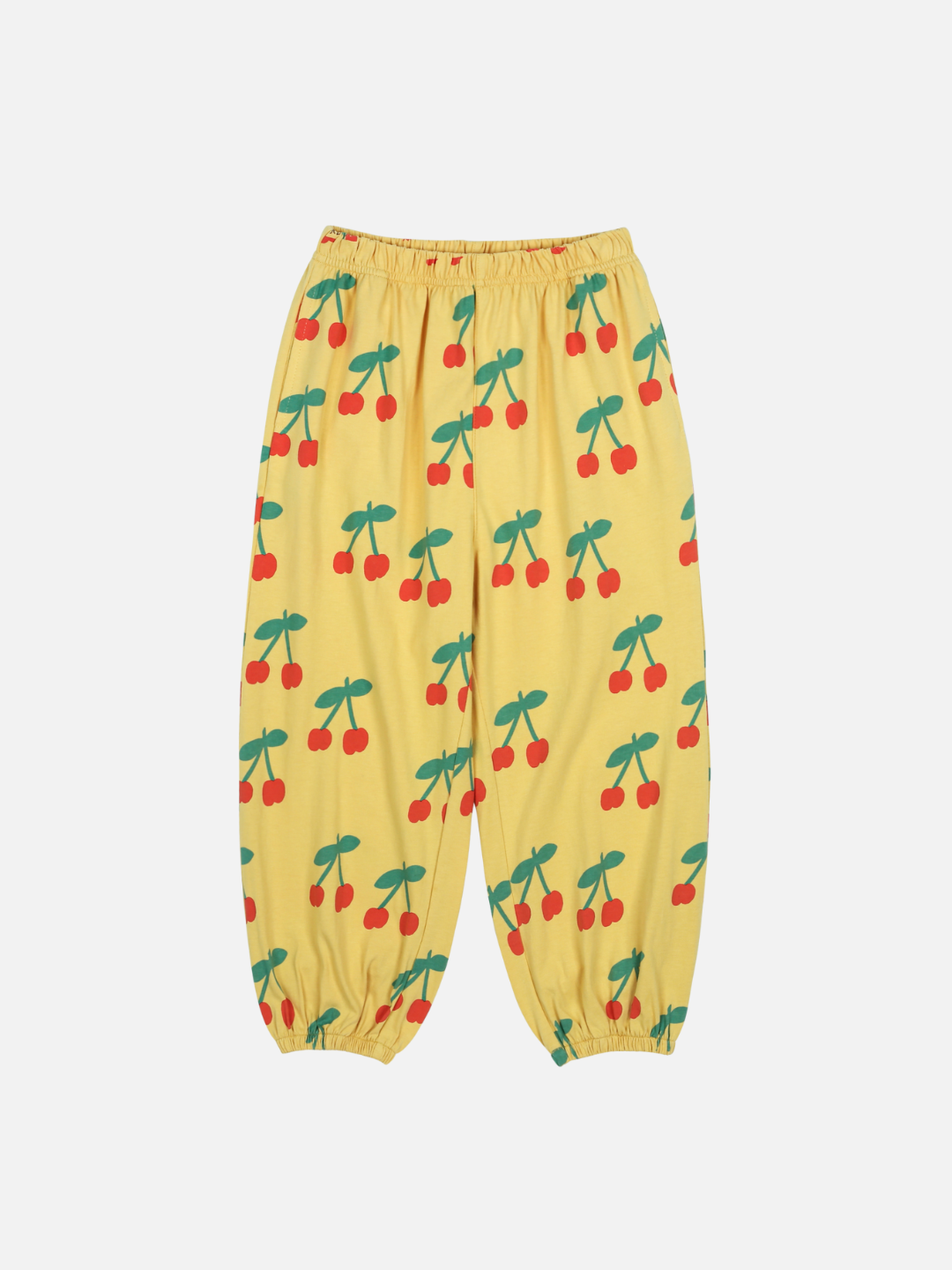 The CHERRY PUFFY PANTS are yellow with an elastic waistband and cuffs, adorned with red cherries and green stems.