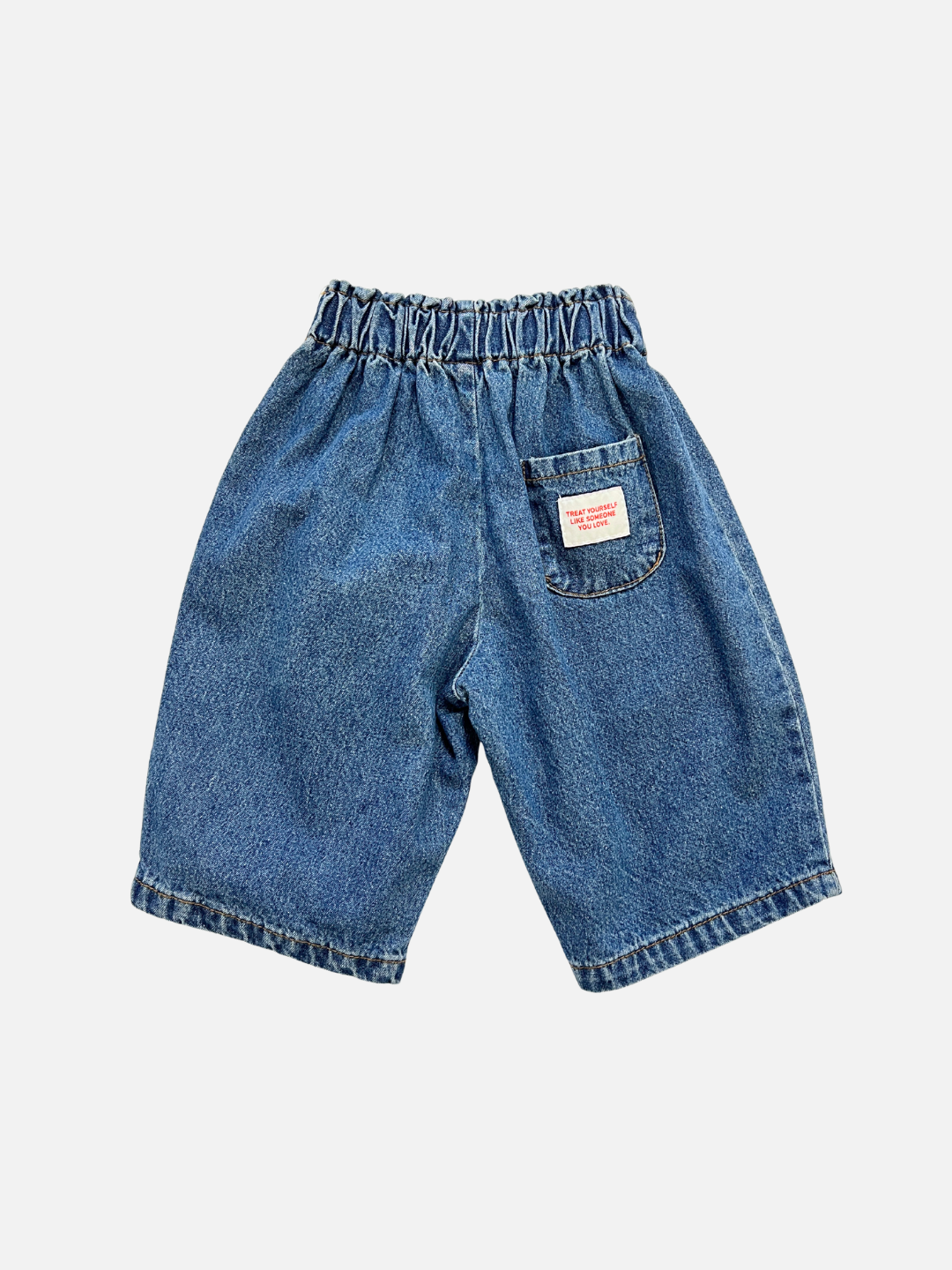 Dark Wash | BABY JEANS: Blue cotton denim, loose fit, elastic waist, and a small back pocket with a white and red label. Displayed against a plain white background.
