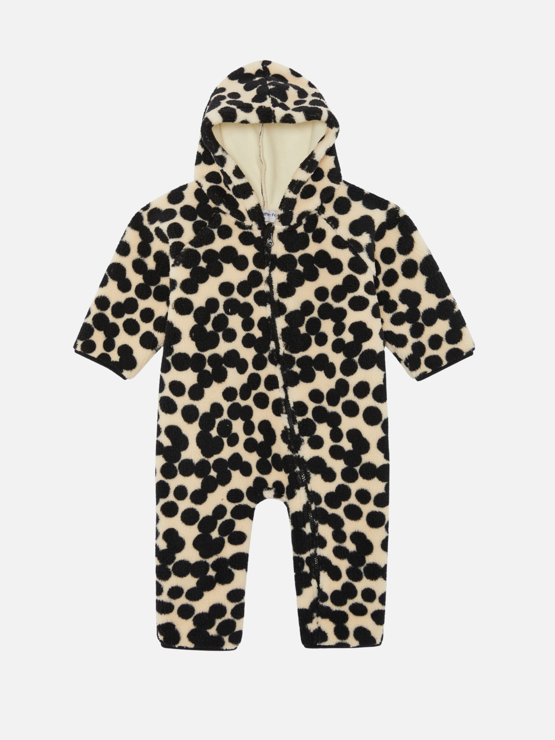 The SPOT STROLLER SUIT, an infant's hooded jumpsuit with a white base and black polka dot pattern, features a convenient zipper closure down the front. Perfect for babies and new arrivals, this adorable piece ensures both comfort and style.