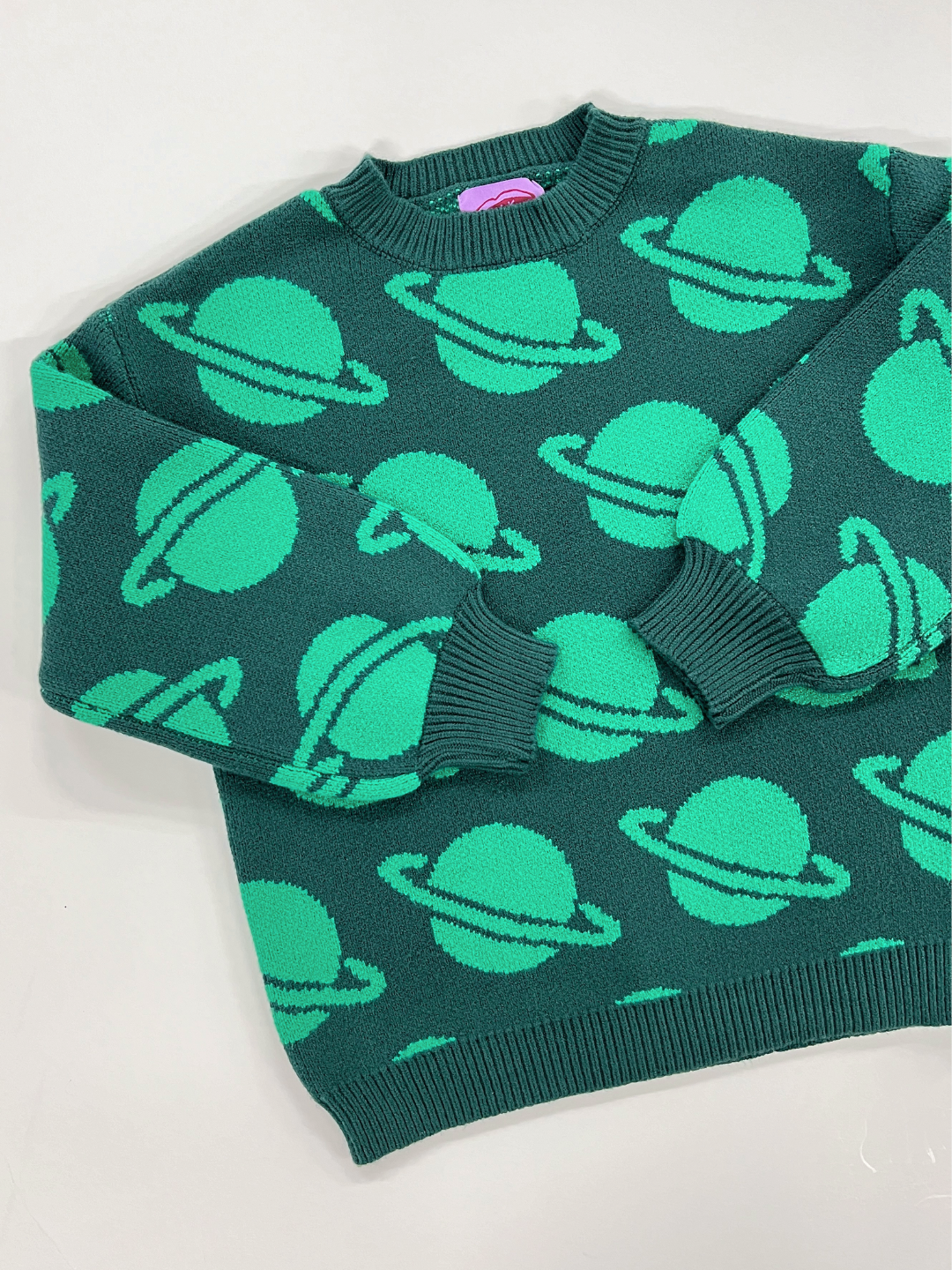 Green | SPACE CAMP SWEATER featuring a green design with light green Saturn planet motifs on a white background; detailed description and measurements are available in photos.