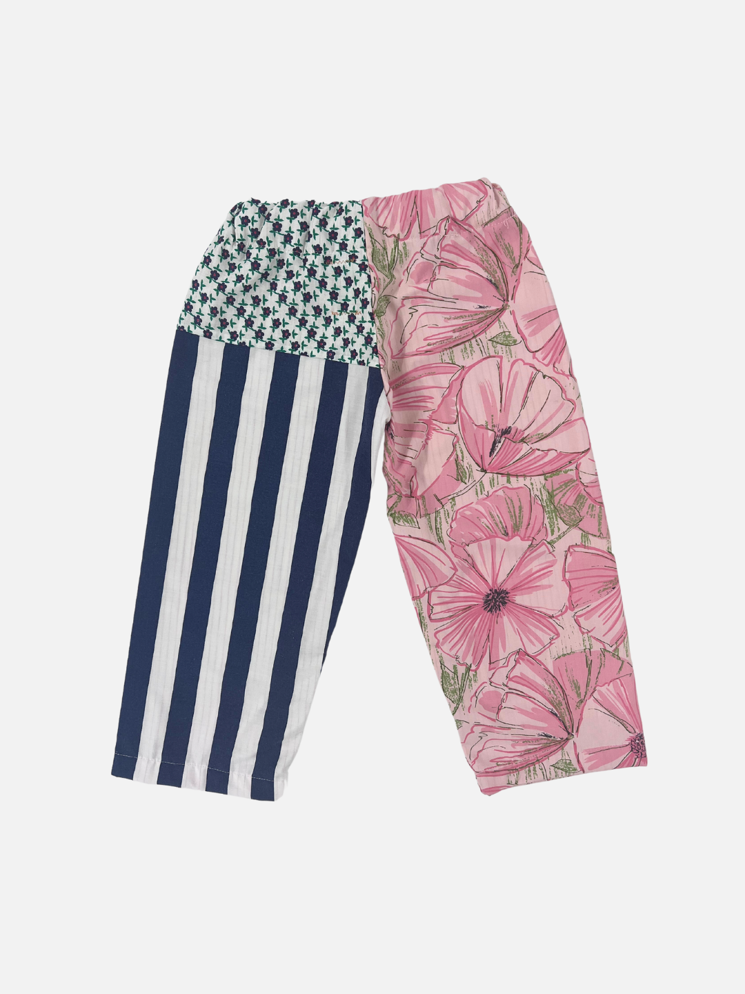 Back view of kid's patchwork pant. Left leg - hibiscus print. Right Leg - navy stripes + little flowers.