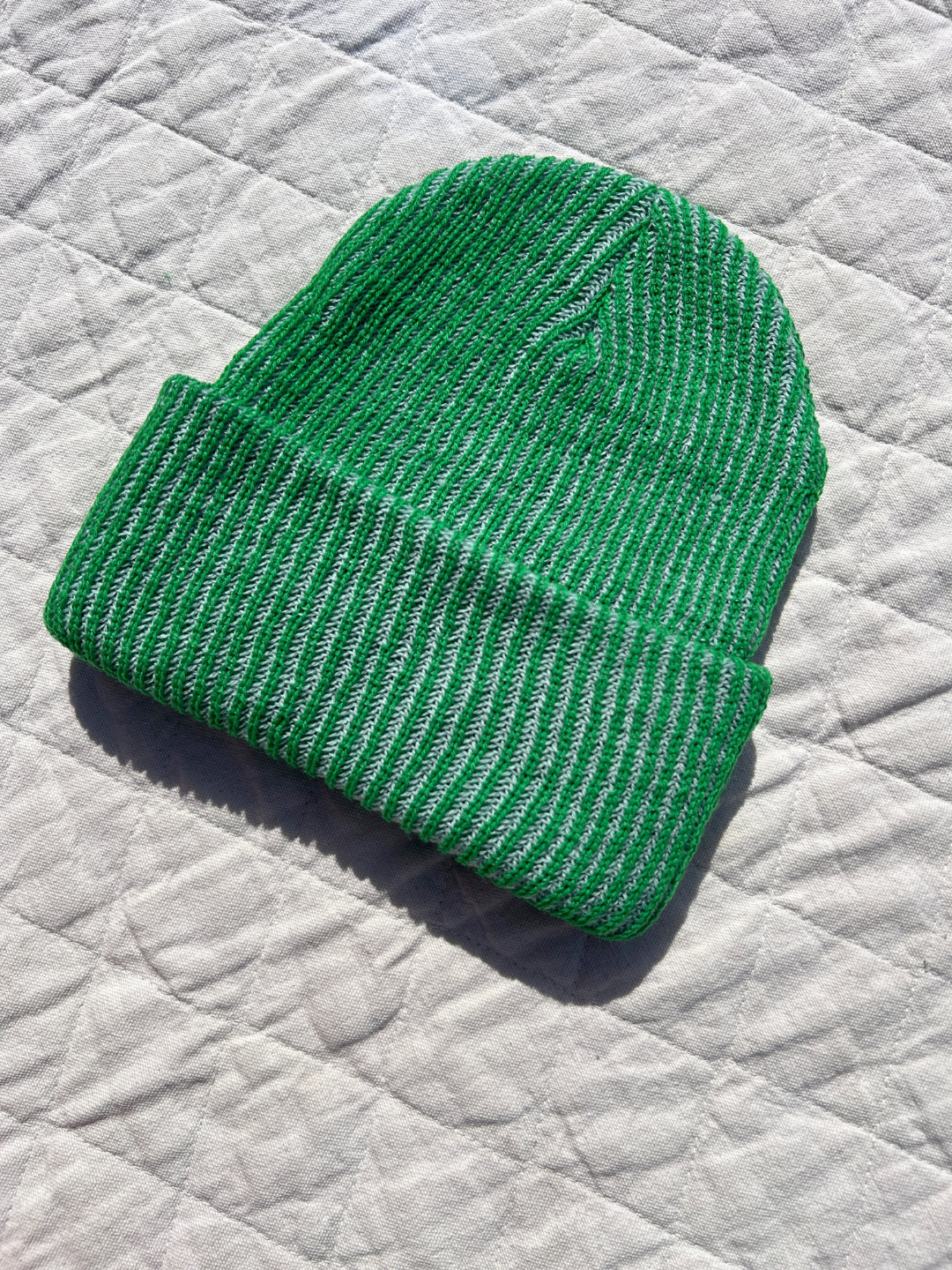 Hat laid flat on a quilt