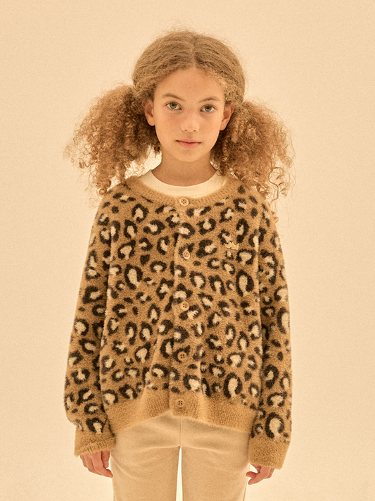 Second image of The COZY LEOPARD CARDIGAN features a brown and black-and-white leopard print, button-up front, long sleeves, and ribbed cuffs and hem. Stylish, it's shown on a plain white background to highlight its trendy design.