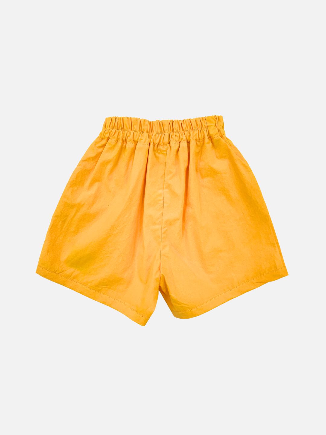 Orange kids' shorts back view.