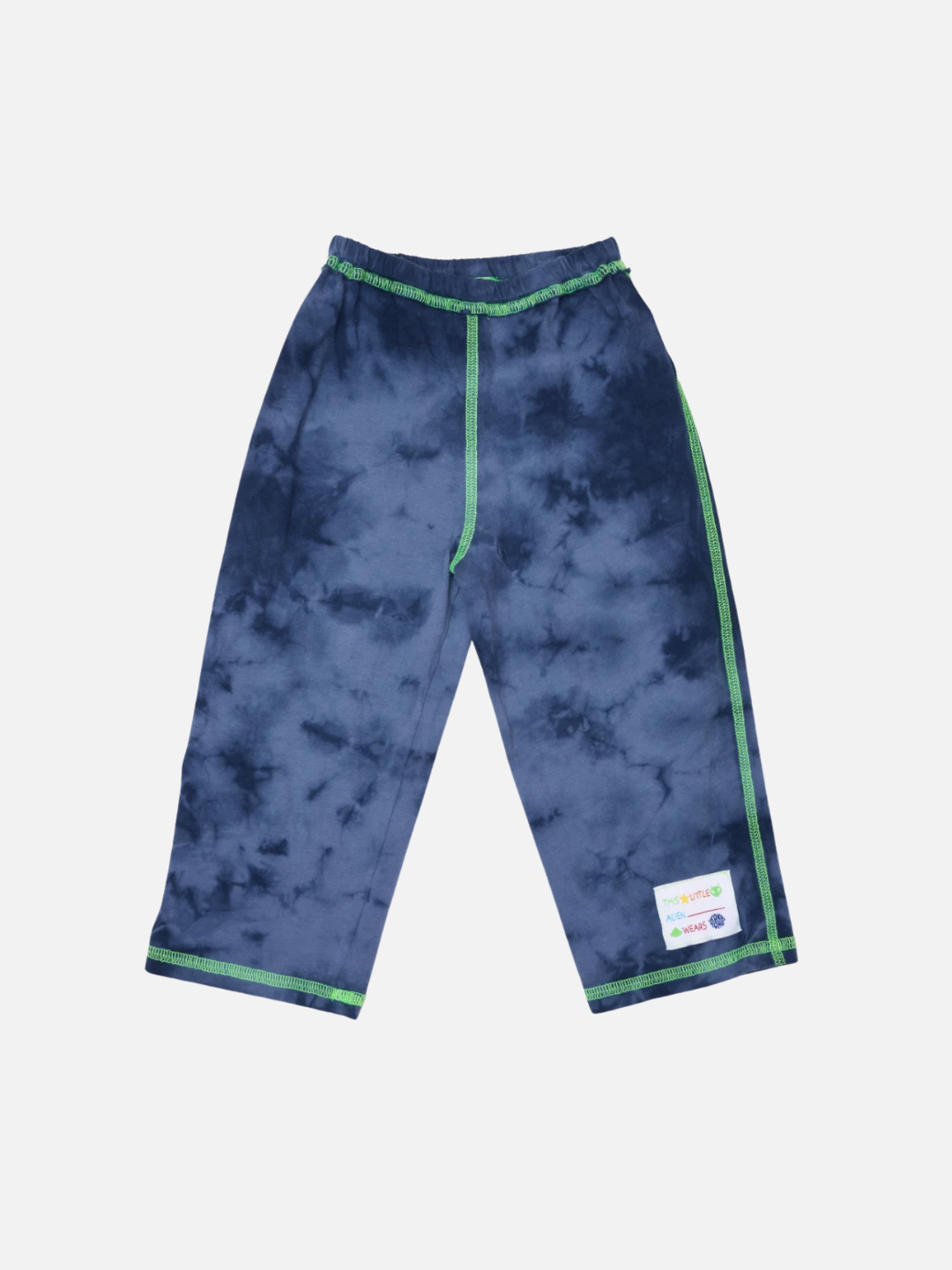 Pacific Blue | The COSMO TIE DYE PANT in Pacific Blue features green trim, an elastic waistband, visible side seam, and a white patch label on the left leg, all crafted from soft cotton jersey.