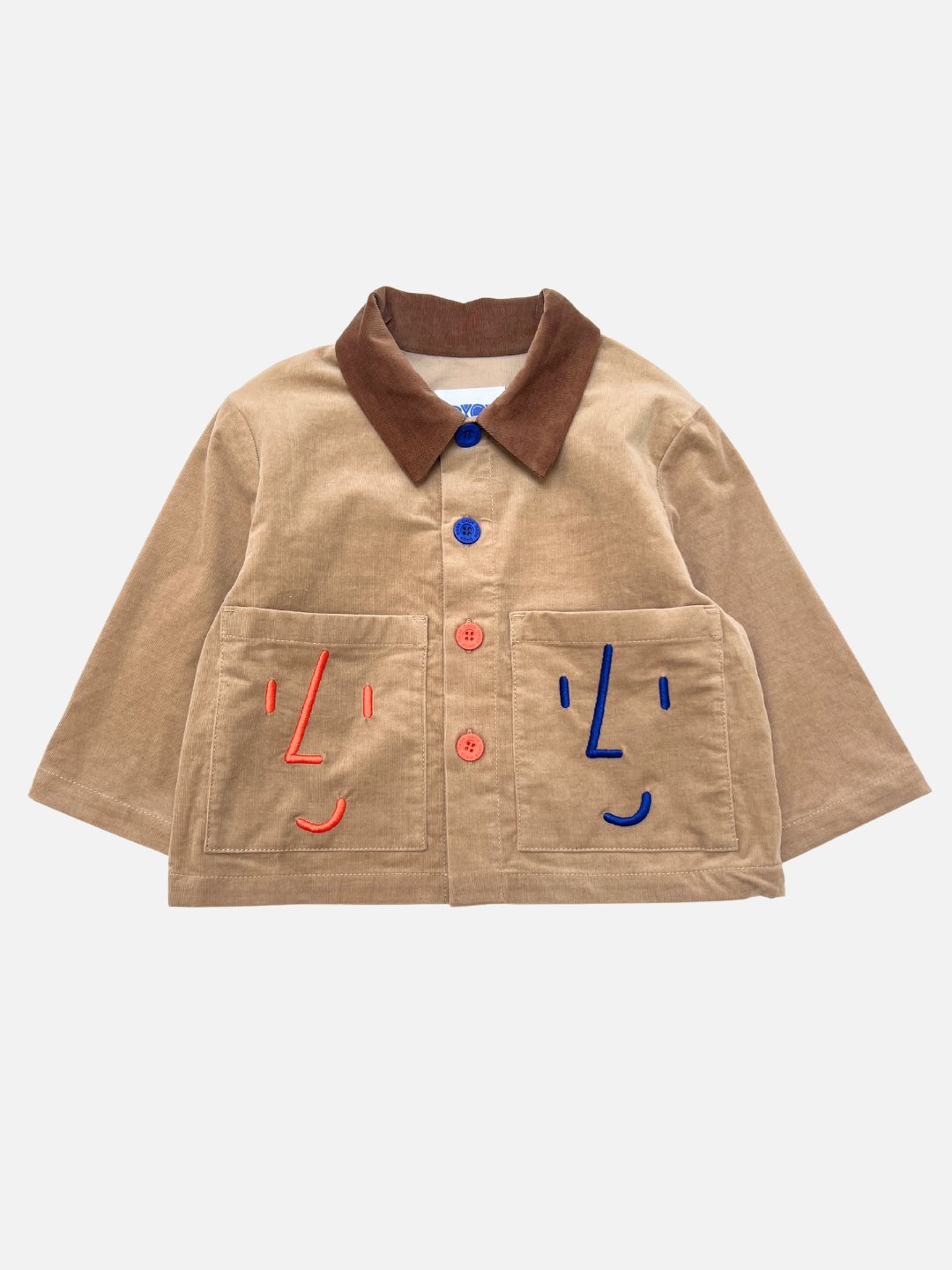 Brown | The FACE JACKET is a brown kids corduroy chore coat with a contrast collar, multicolored buttons, and two front pockets embroidered with red and blue face designs.