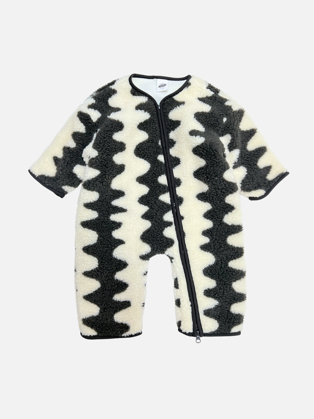 Charcoal | The WAVELENGTH SHERPA FLEECE STROLLER SUIT in charcoal features black and white wavy zigzag patterns, crafted from cozy sherpa fleece for winter warmth, shown on a plain white background. 