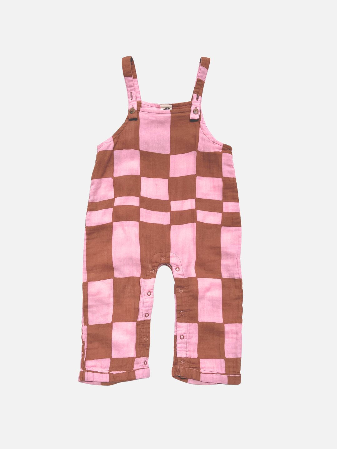 MUSLIN OVERALLS in Pink Checkers, made from soft organic cotton with shoulder straps and snap buttons at the leg openings, shown on a white background.