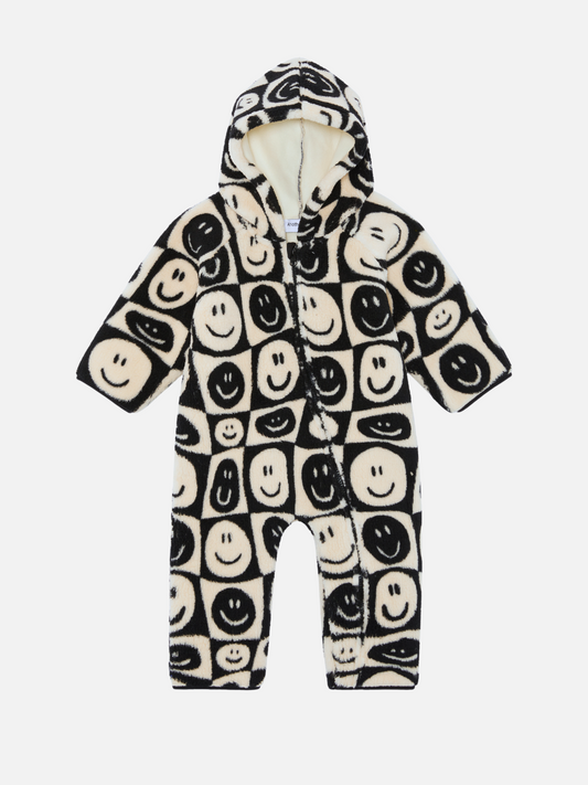 Image of Discover our new arrival: the FACE CHECKER STROLLER SUIT, a hooded baby onesie adorned with a black and white smiley face pattern. Perfect for your little one!