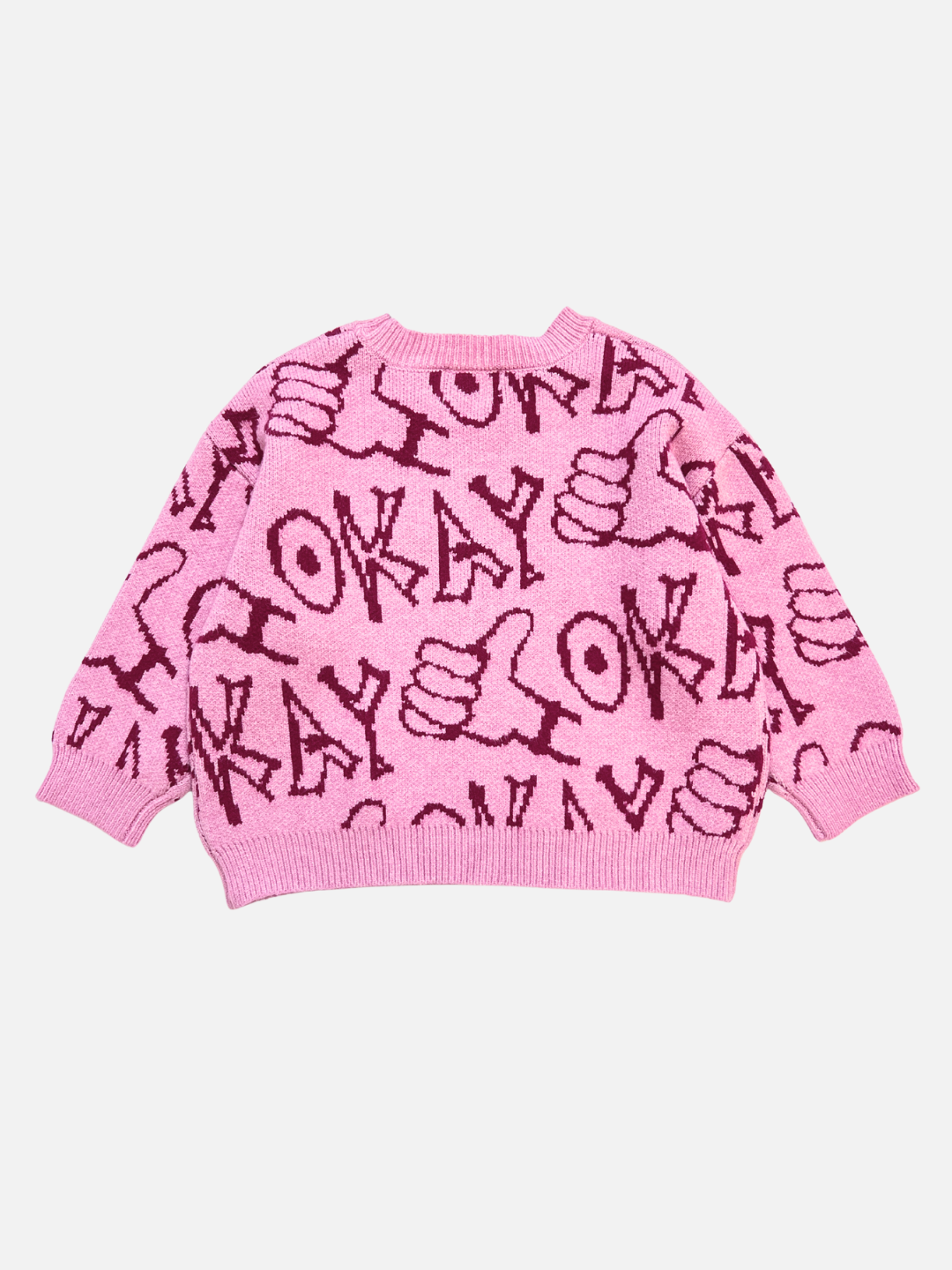 The OKAY SWEATER is a pink sweater with maroon "OKAY" text and thumbs-up hand symbols in a repeating pattern.