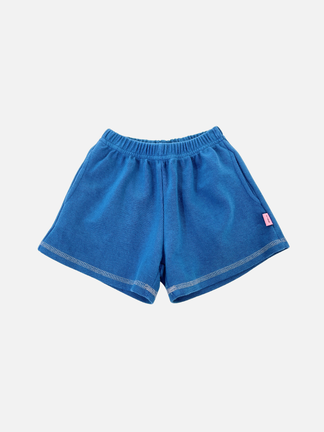 Blue | VARSITY SWEAT SHORTS in blue, featuring a vintage-inspired fit with an elastic waistband and a small pink side tag, set against a plain white background.