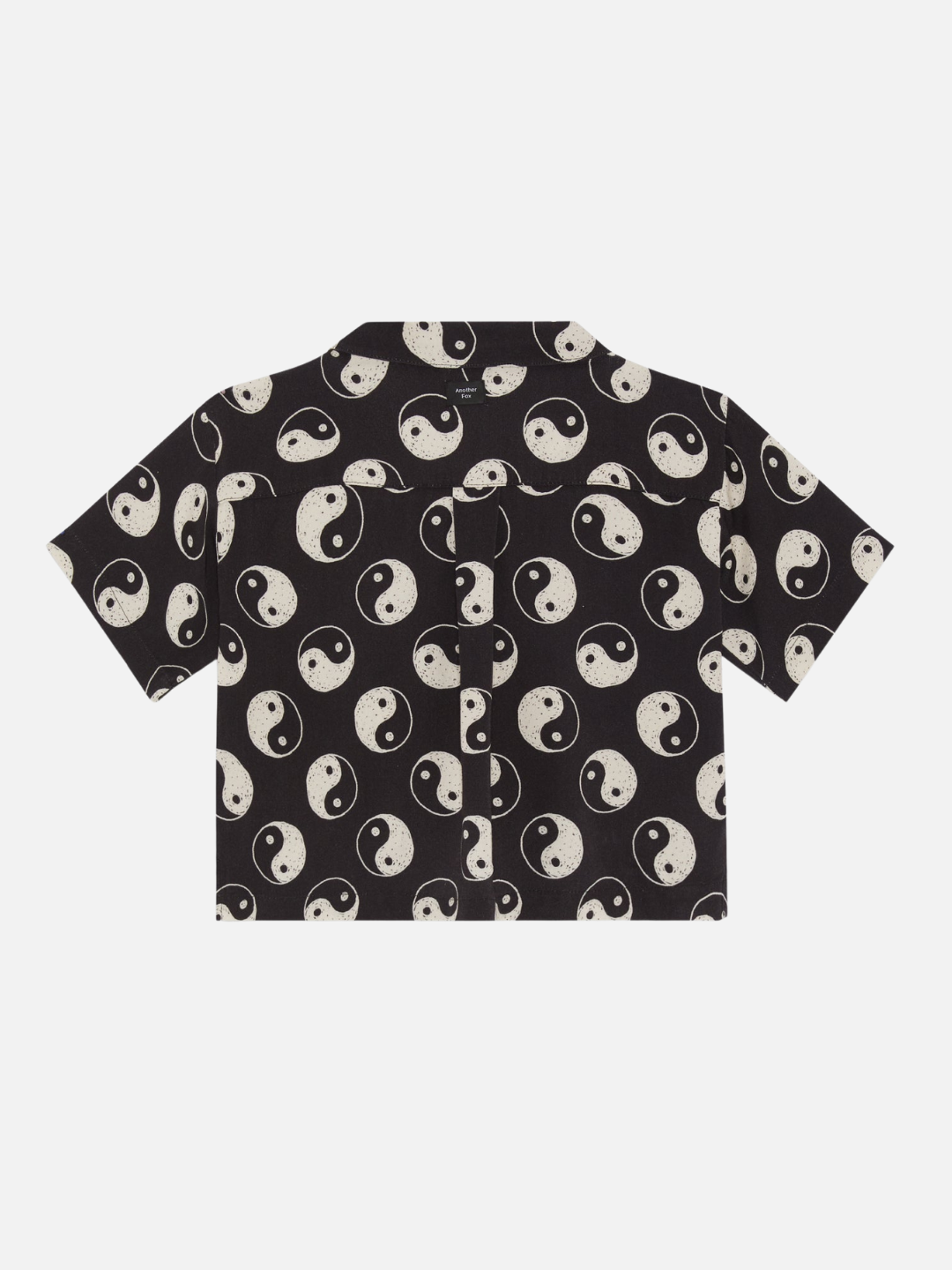 A back view of the black button up shirt with a yin and yang pattern all over.