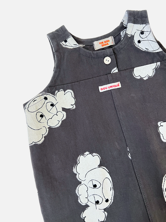 Second image of The POODLE OVERALL is a dark blue romper by a Korean kids' label, featuring a white cartoon ghost pattern. It includes shoulder straps and a front button, ideal for playful adventures.