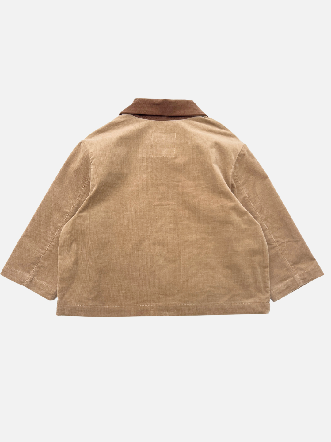 Back view of the FACE JACKET, a tan corduroy chore coat with long sleeves and a contrasting brown collar, laid flat on a white background.