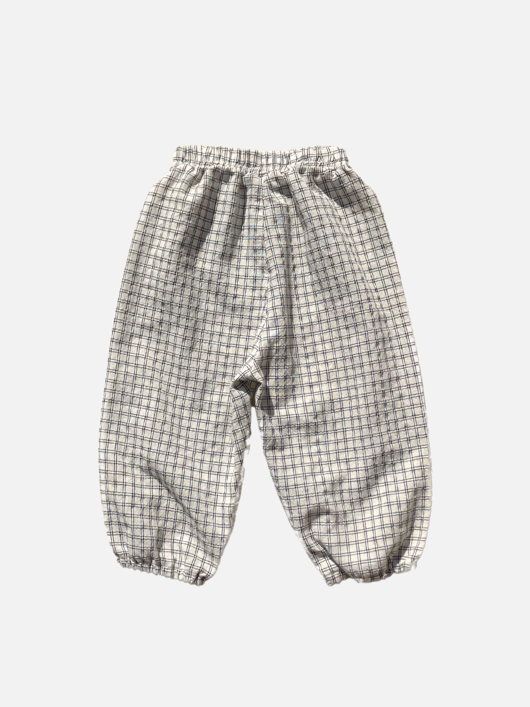 Back view of the kids' Grid Check Pull on Pant. Cream fabric with light black grid print.