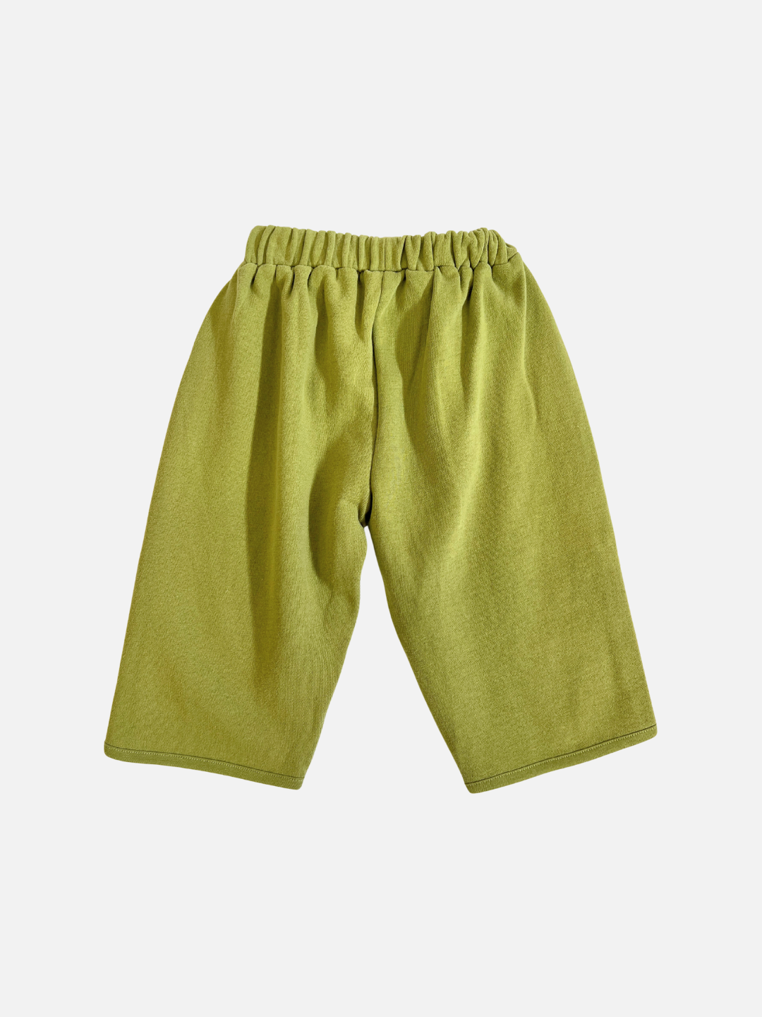 The ALVIE MATCHA SWEATPANT is a loose-fitting, high-waisted green pant with an elastic waistband, shown against a plain white background.