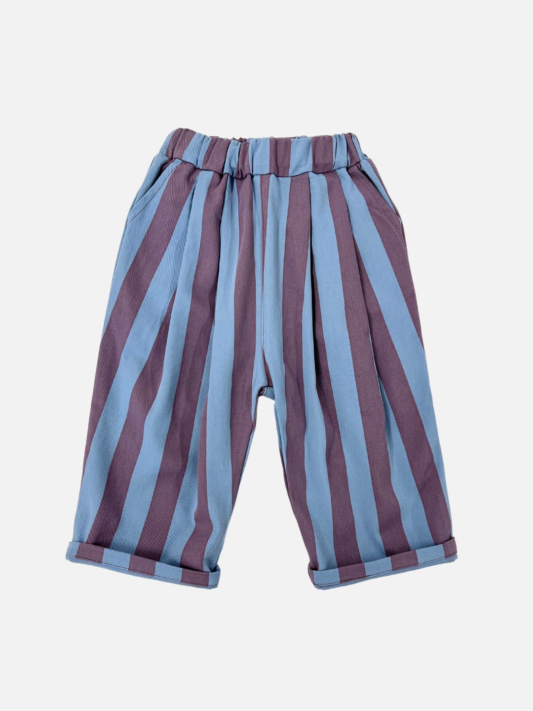Front view of kids baggy pants in blue with wide purple vertical stripes.