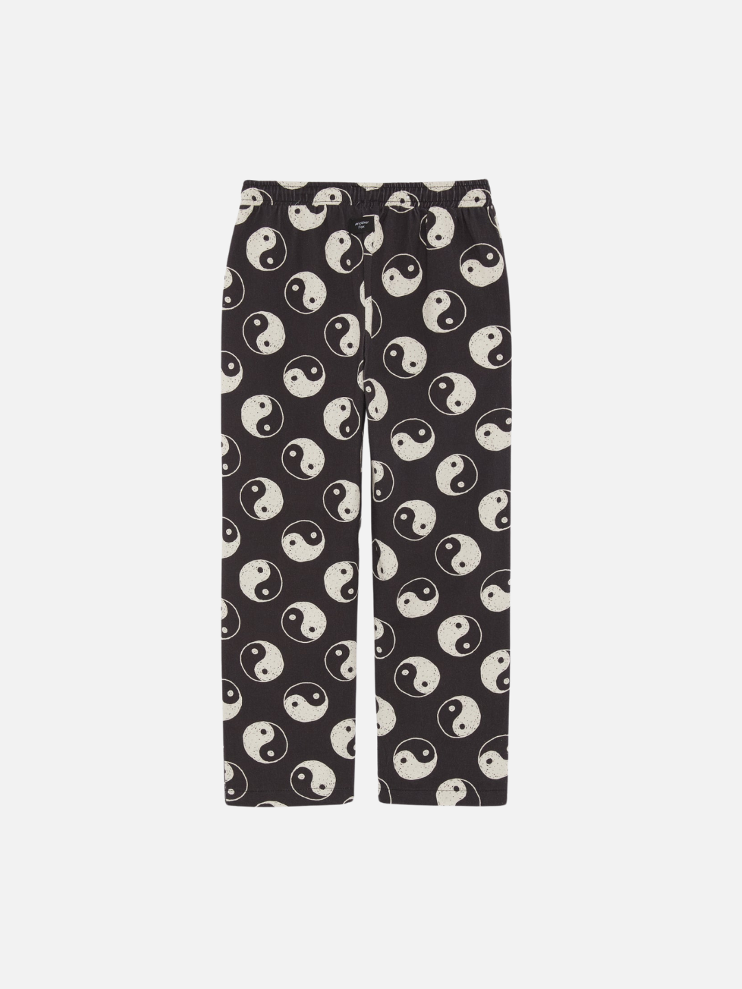 A back view of the drawstring black pants with a yin and yang pattern all over.