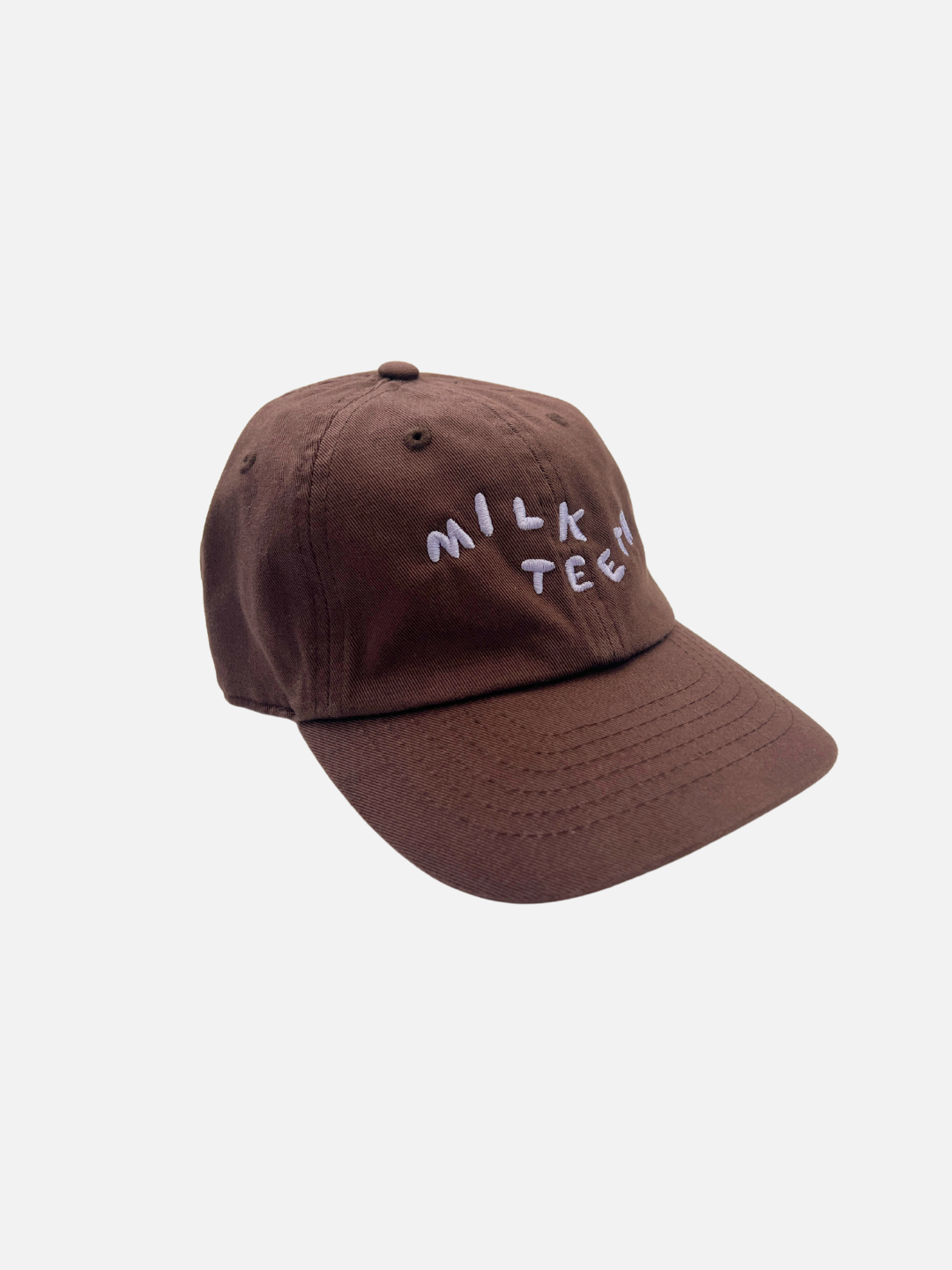 A front view of the Milk Teeth Cap with lavender embroidery