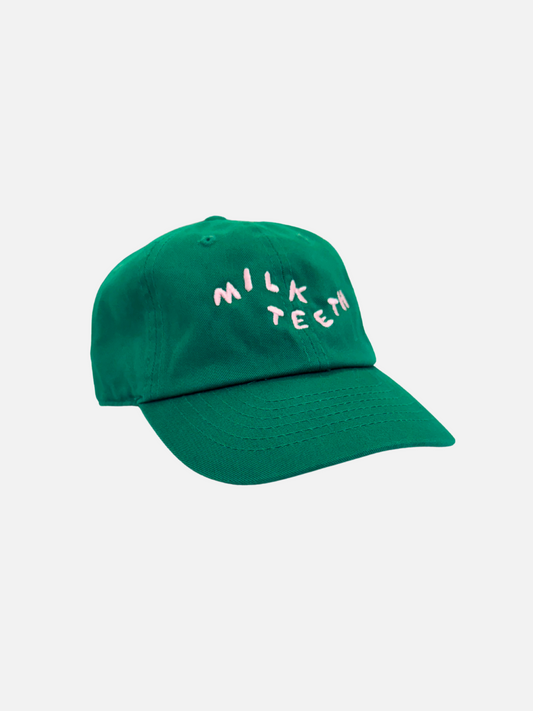 Image of Kelly Green | A front view of the Milk Teeth Cap with pink embroidery