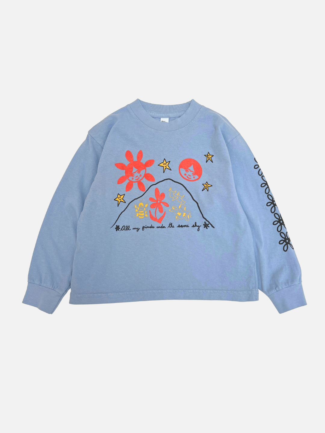 The ALL MY FRIENDS LONGSLEEVE in blue features colorful graphics of flowers, cats, and stars with “All my friends under the same sky” on the front, plus black floral line art on one sleeve.