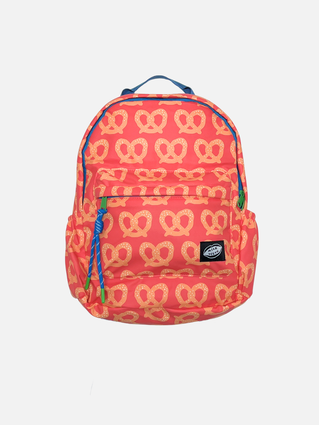 Red Pretzel | A red and tan backpack with a repeating pretzel pattern, featuring blue accents on the zipper pulls, top handle, and piping, and a black Milk Teeth logo patch on the front pocket.