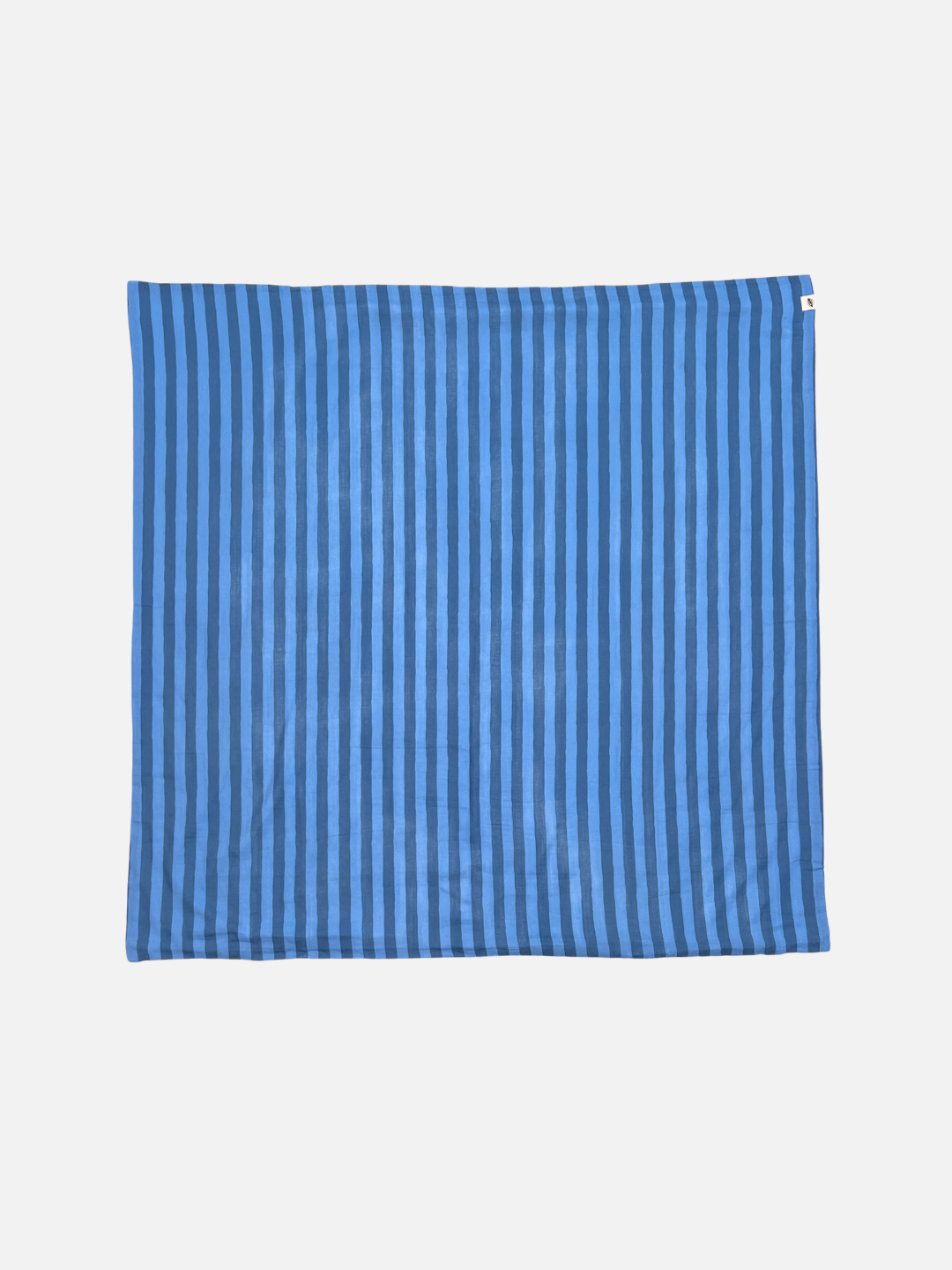 Blue Stripe | A medium blue and darker blue striped cotton swaddle is shown flat on a light grey background.