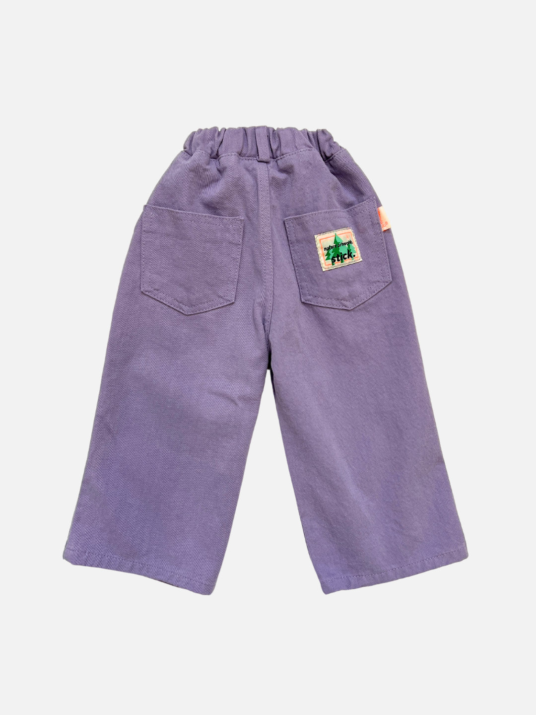 A back view of kid's Grape Jeans with elastic waist and Stick logo on right back pocket