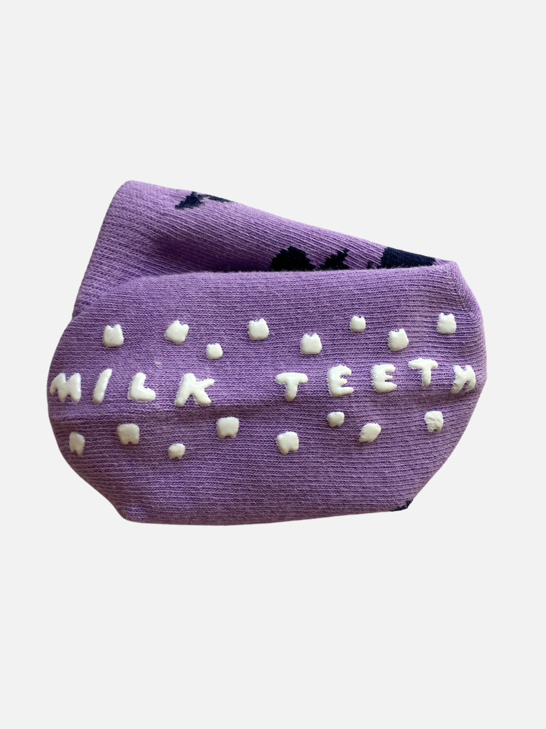 Violet Lovestruck | Purple beanie with the text "GRIP SOCK" and small white shapes resembling teeth, crafted from a plush, stretchy material for ultimate comfort.