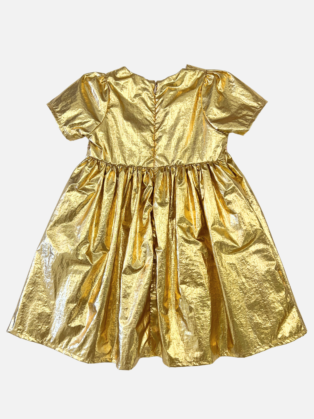 Back view of kids party dress in yellow gold metallic fabric with a round neck, short sleeves, empire waist and full skirt.