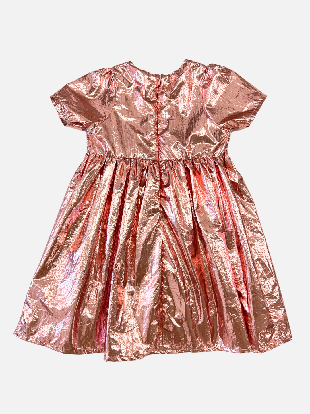 Rose | Back view of kids party dress in pink metallic fabric with a round neck, short sleeves, empire waist and full skirt.