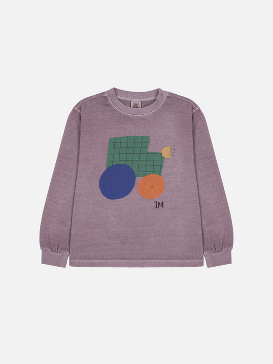 Image of The TRACTOR PIGMENT LONGSLEEVE T-SHIRT is a purple sweatshirt with abstract geometric designs, such as a green grid square, blue and orange circles, and "JM" initials at the bottom.