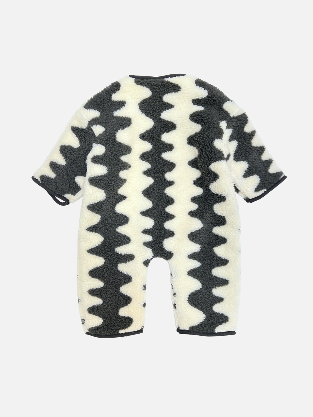 The WAVELENGTH SHERPA FLEECE STROLLER SUIT features black and white wavy zigzag stripes and is shown from the back on a plain white background—a cozy baby romper ideal for winter strolls.