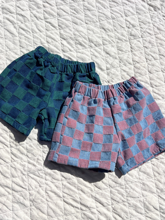Second image of Green | The TWO TONE DENIM CHECK SHORTS, in green with a checkerboard jacquard pattern and elastic waistband, from a popular Korean kids brand, are displayed against a plain white background.