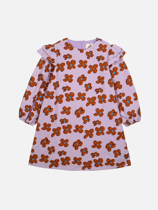 Image of The FLOWER FRILL DRESS, a long-sleeved children's dress with a light purple background adorned with an orange and red floral pattern and charming ruffled shoulders, is perfect for showcasing in your merchandising lineup.