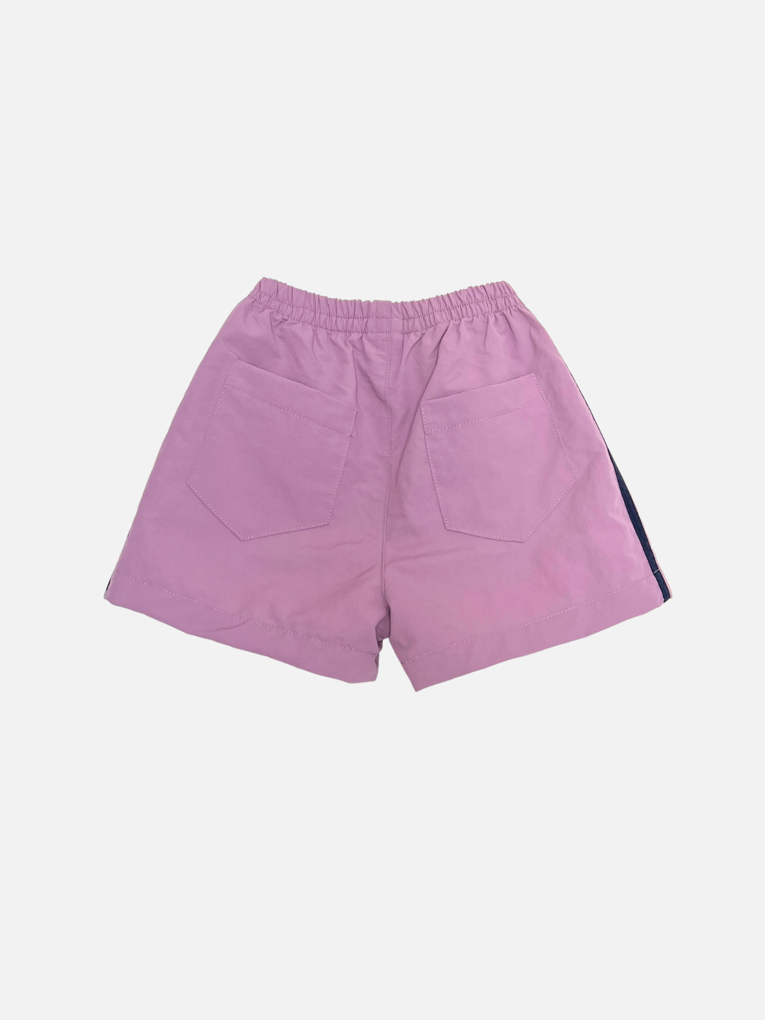 Back view of SPRINTER SHORTS in light purple featuring an elastic waistband and two large square back pockets, shown on a plain white background.