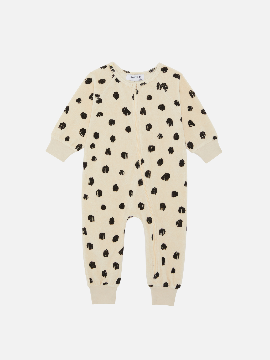 Front view of the baby Cheetah Terry Towel Sleepsuit featuring a zipper. Black cheetah spots on ivory background.