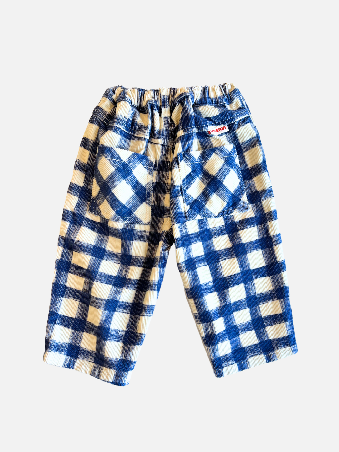 Back view of kids corduroy trousers in white with a large blue grid check pattern.