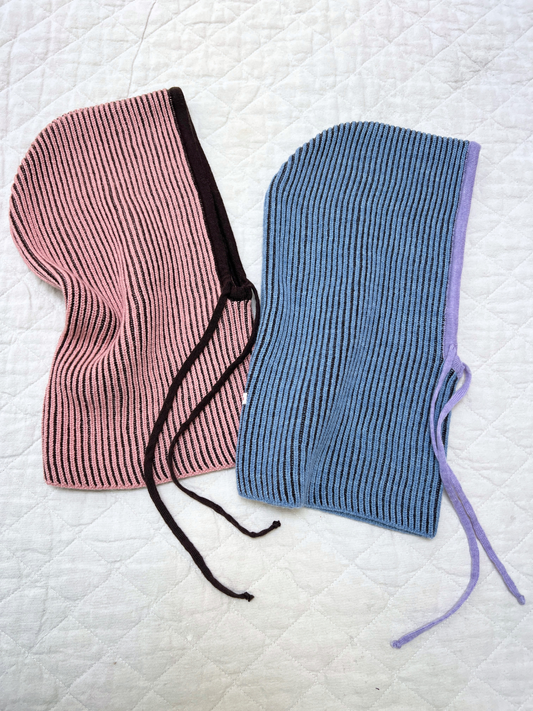 Second image of Icy Stripes | The MERINO BALACLAVA in Icy Stripes features a curved top and side drawstring for thermal comfort, shown against a plain white background.