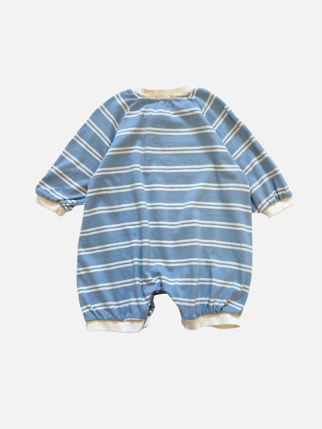The SLOUCHY STRIPE ROMPER, a blue and white striped cotton jersey piece by a Korean baby brand, features cuffed long sleeves and legs and is shown laid flat on a white background.