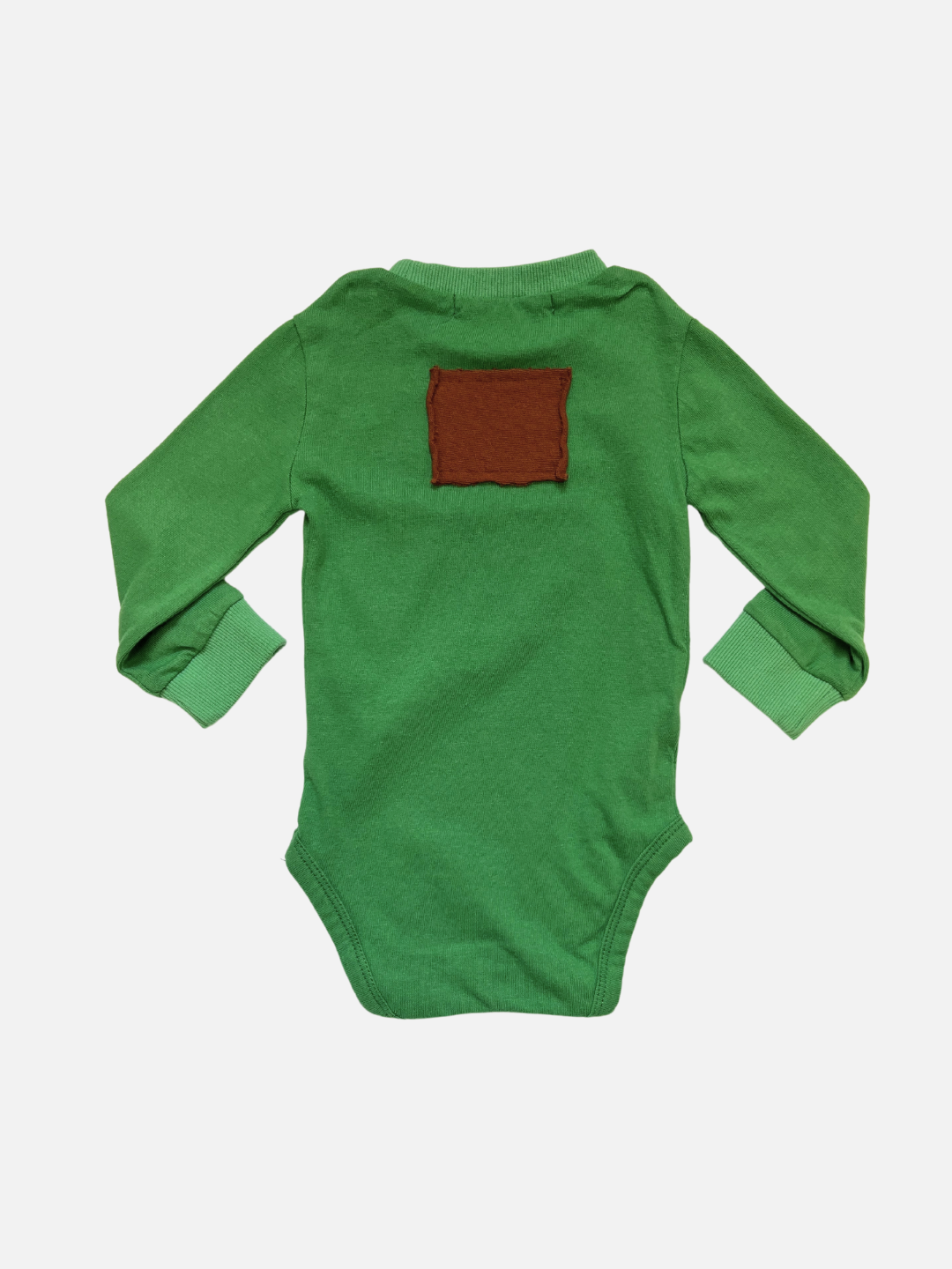 A back view of the patch onesie in Green with a brown rectangular patch on the back