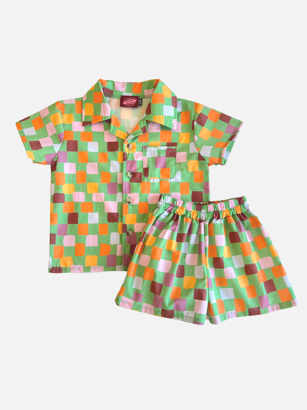 Green | A kids' shirt and shorts set in a pattern of purple, pink, gold and orange squares on a green background