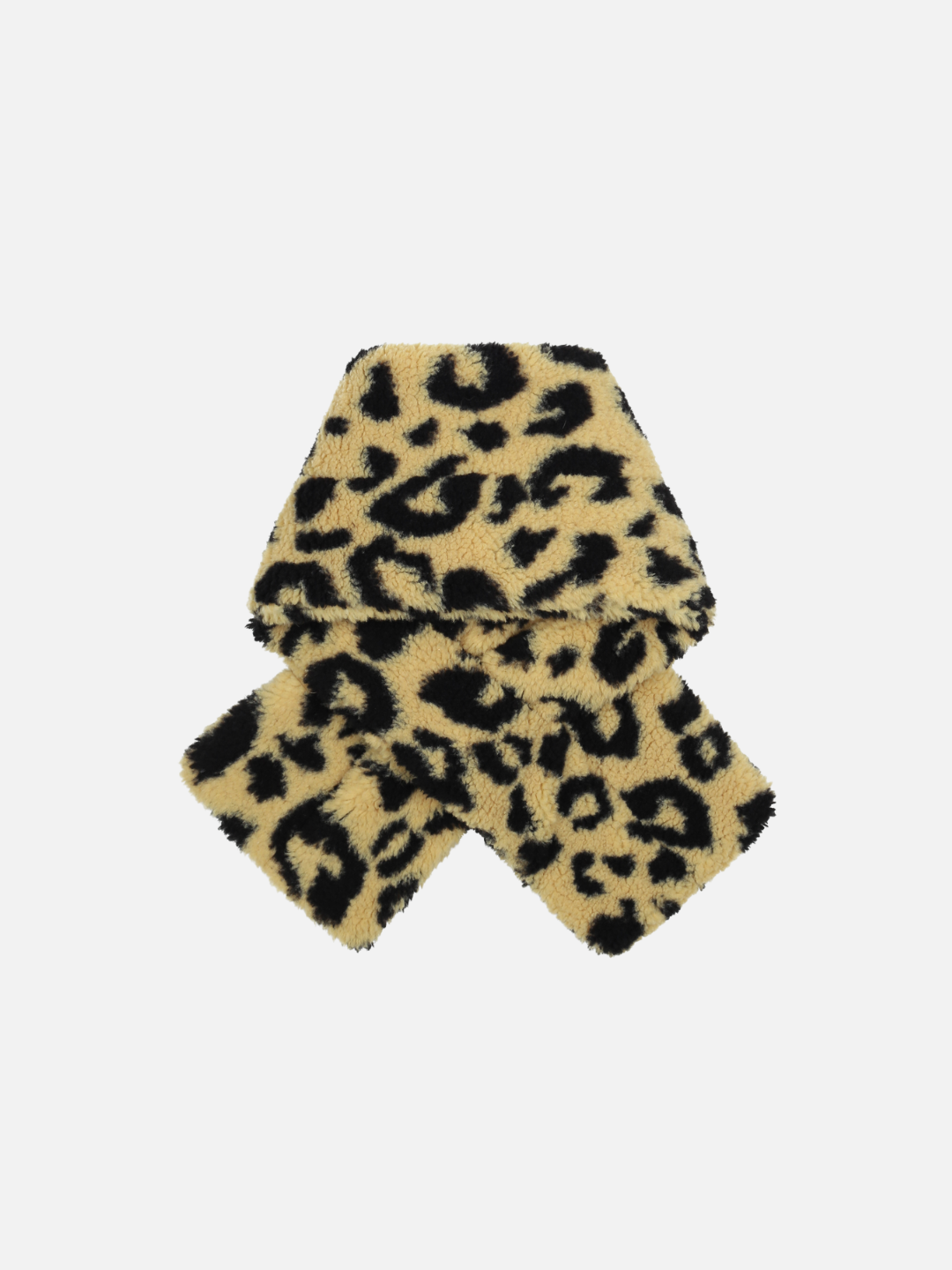 The LEOPARD PATCH SCARF, a luxuriously soft combination of beige and black leopard print, is expertly folded and positioned against a plain white background, showcasing merchandising finesse at its finest.