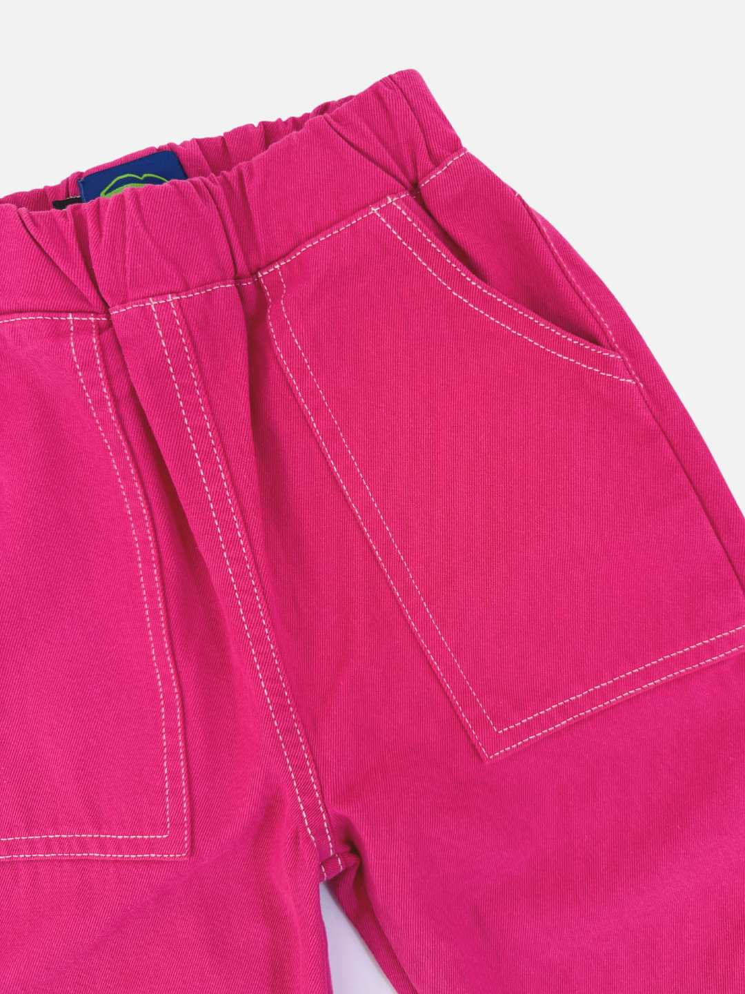 Magenta | The TOPSTITCH TWILL PANTS are bright pink, relaxed pull-on pants featuring an elastic waistband and visible stitching, crafted from soft cotton twill, displayed against a plain light background.