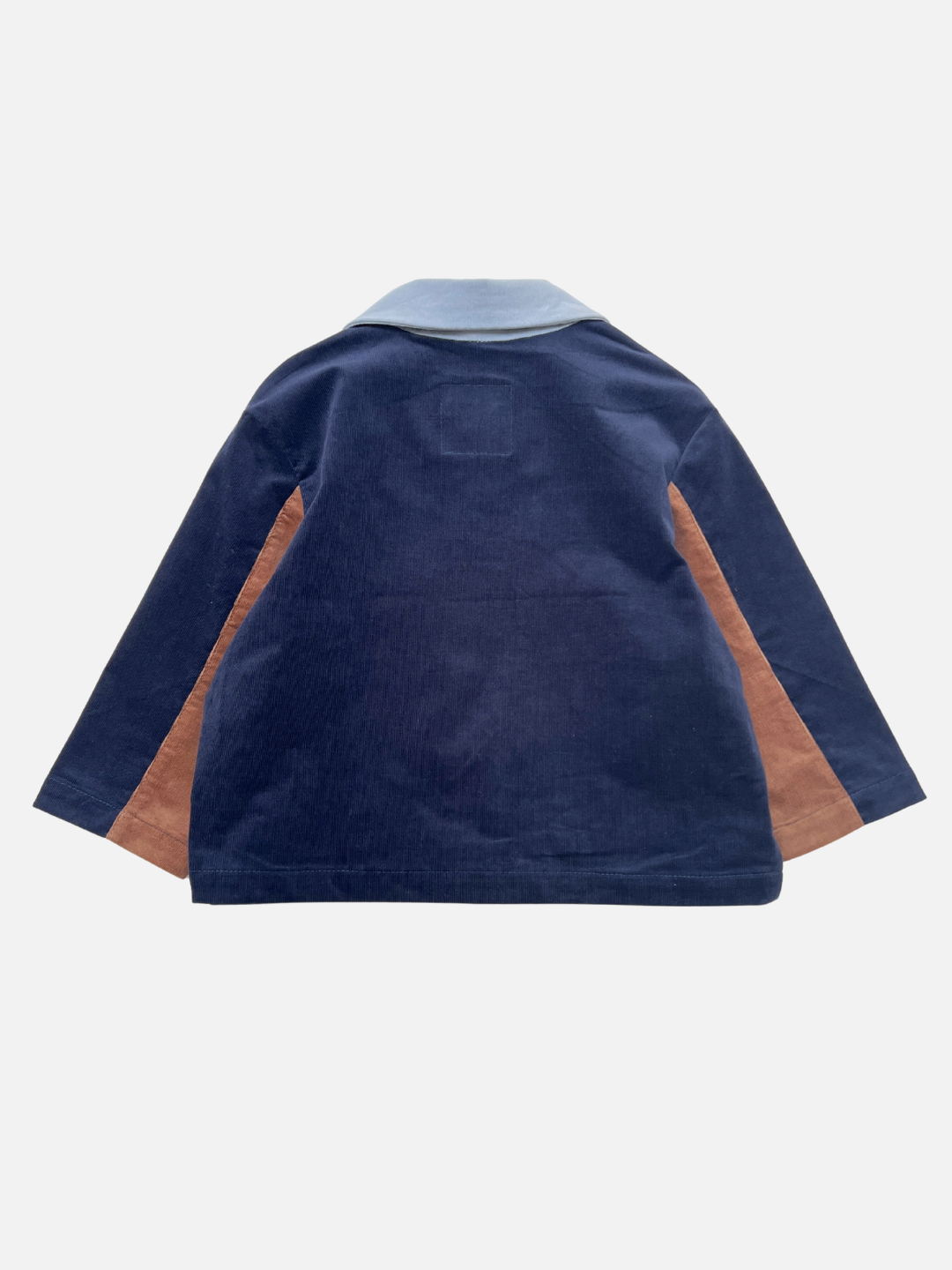 The FACE JACKET is a kids' navy blue corduroy jacket featuring a light blue collar and brown side panels, displayed from the back against a plain white background.