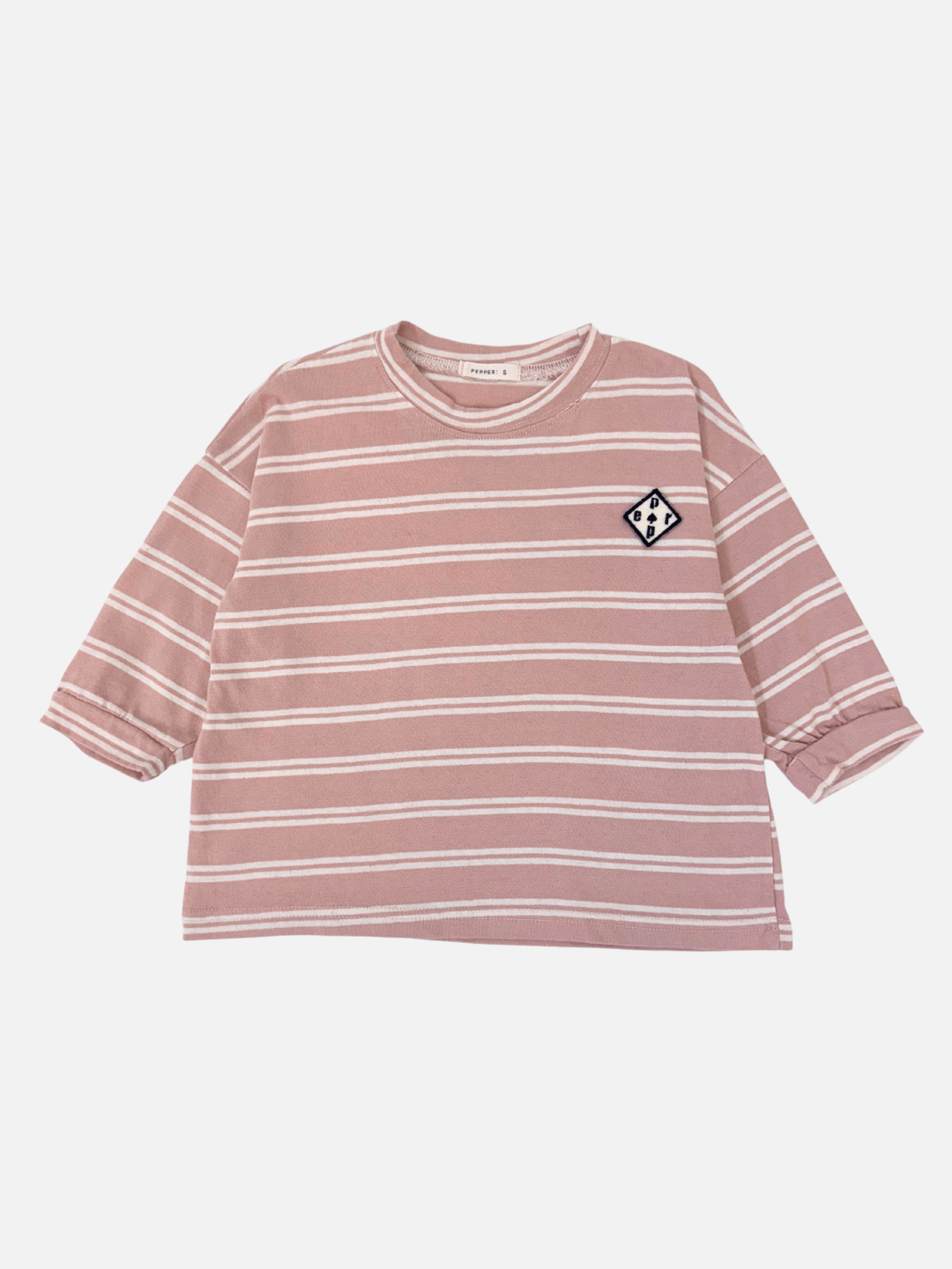 Pink & White | The PEPPER LONGSLEEVE TEE, in pink and white stripes, showcases a boxy silhouette with a small emblem on the upper left. Displayed on a white background, it's ideal for fans of Korean kids' brands who value style and comfort.