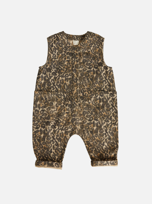 Image of The WREN LEOPARD OVERSIZED OVERALL is an infant romper with a brown and black oversized leopard print. Crafted by a trusted British brand from soft organic cotton, this unisex piece includes two front pockets and a convenient snap closure for easy dressing.