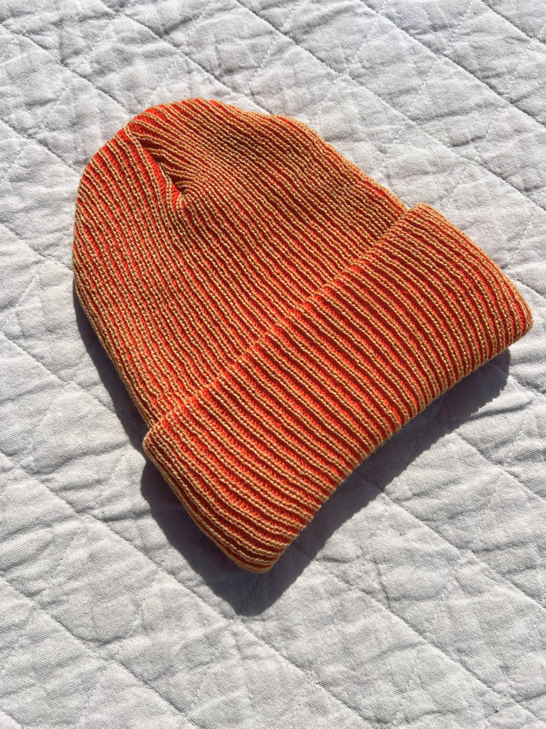 Camel Poppy | Hat laid flat on the quilt